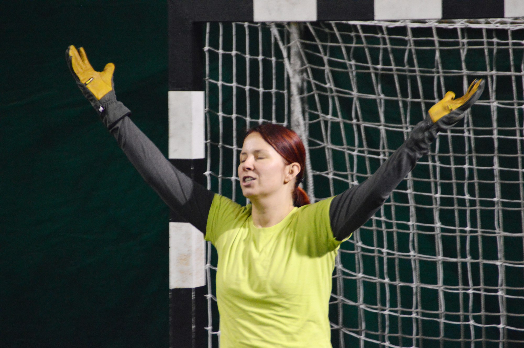 A female goalkeeper during a handball match