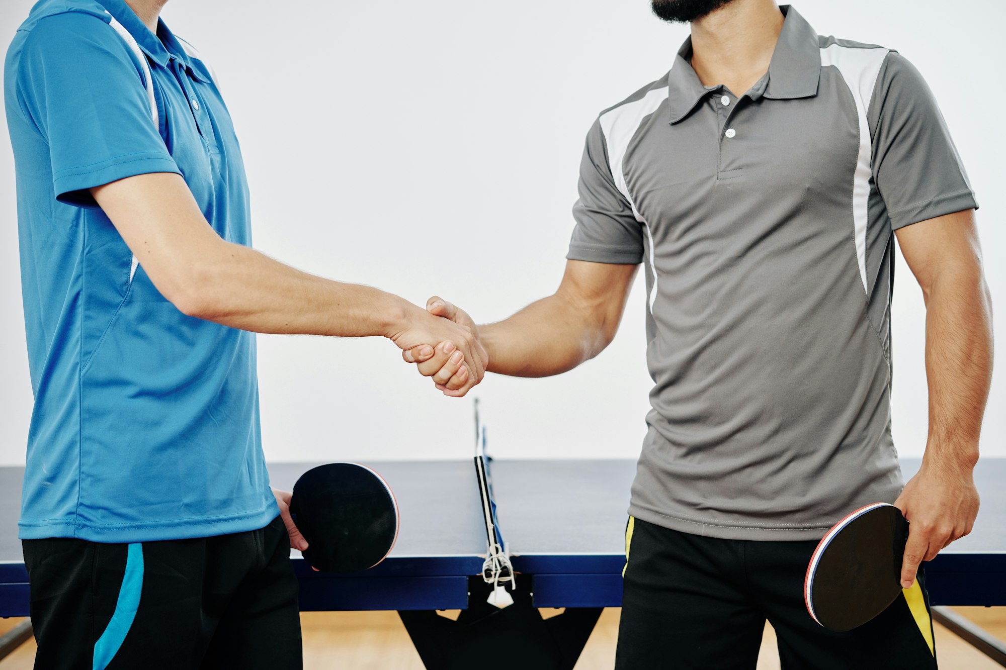 Ping pong players shaking hands