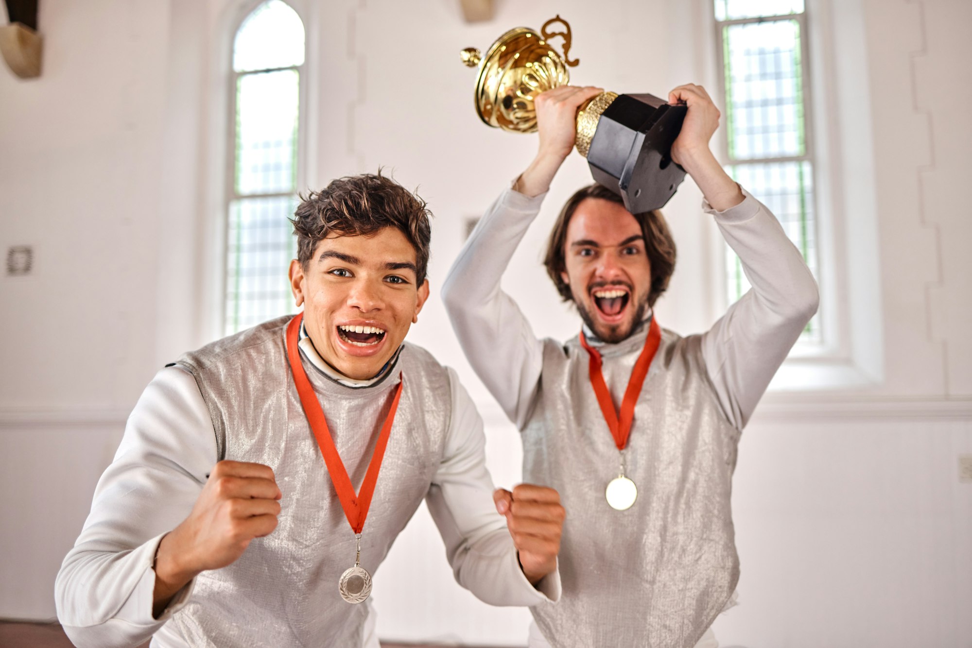 Sports, fencing and portrait of men with trophy for winning competition, challenge and match in gym